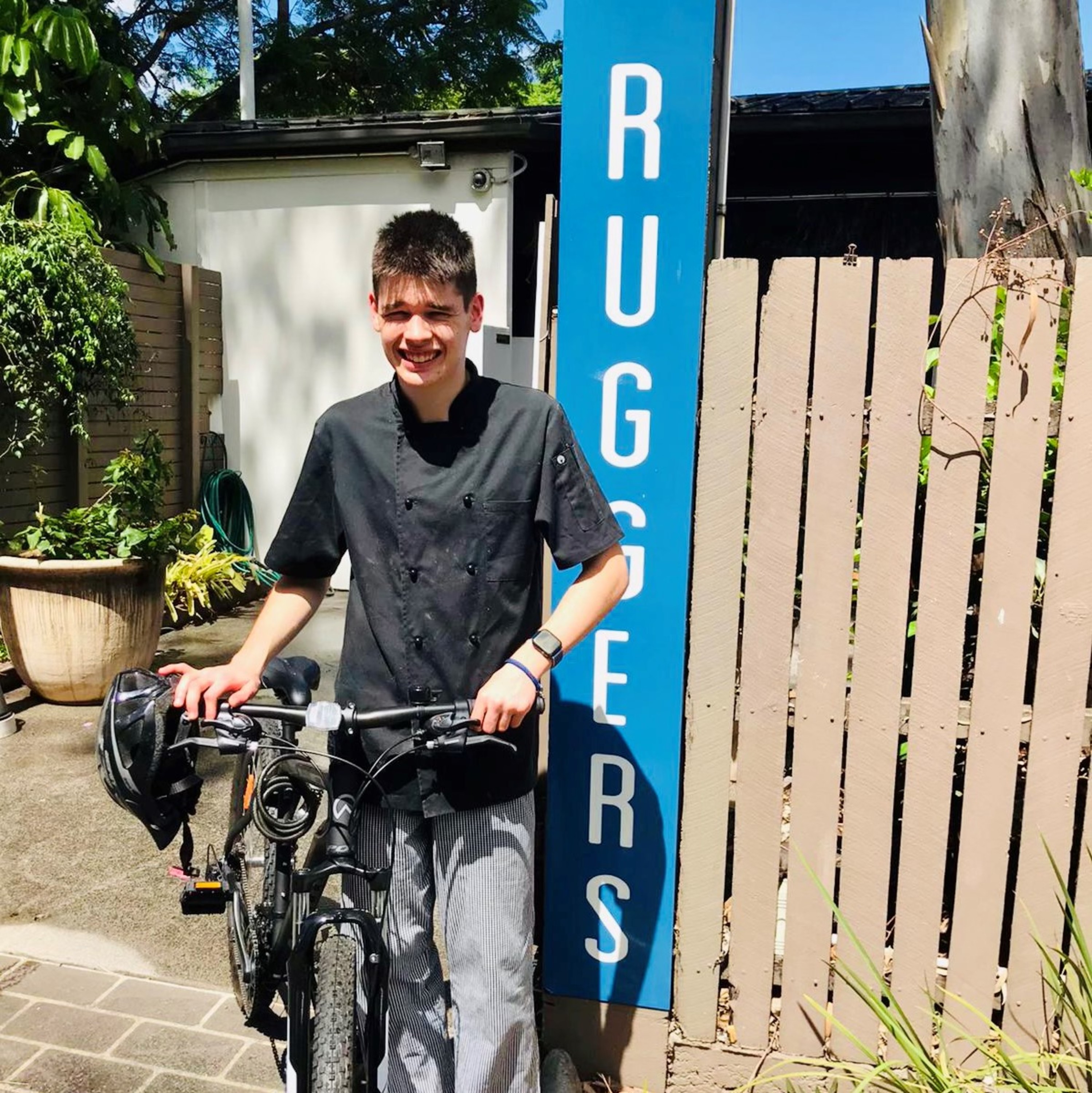 Max with his bike at Ruggers Restaurant.